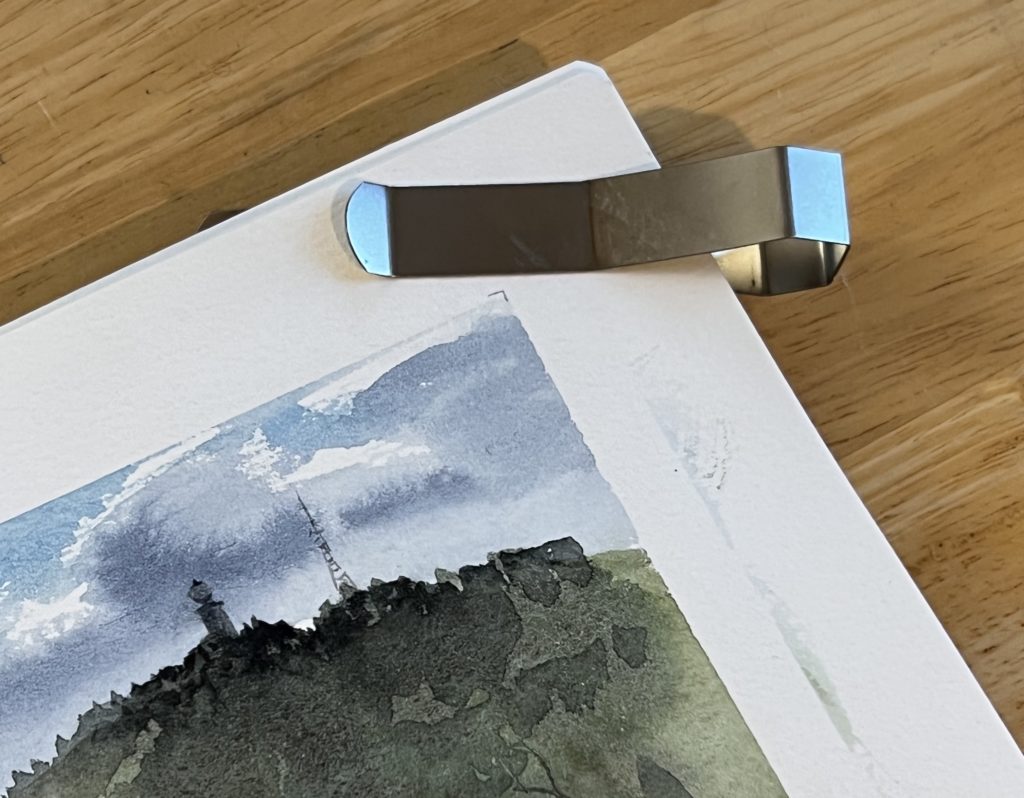 Portable page clips for sketchbook pages.