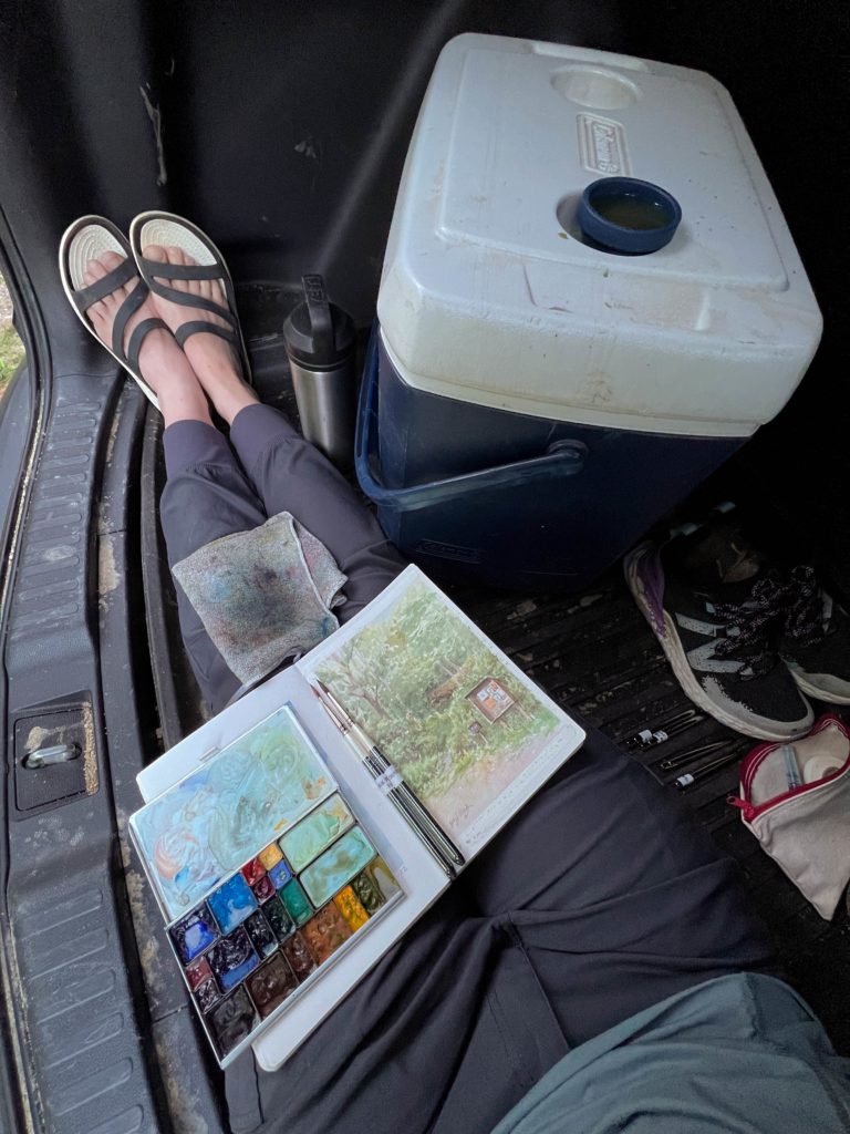 Picture of sketch done plein air in back of car using portable watercolor painting kit.