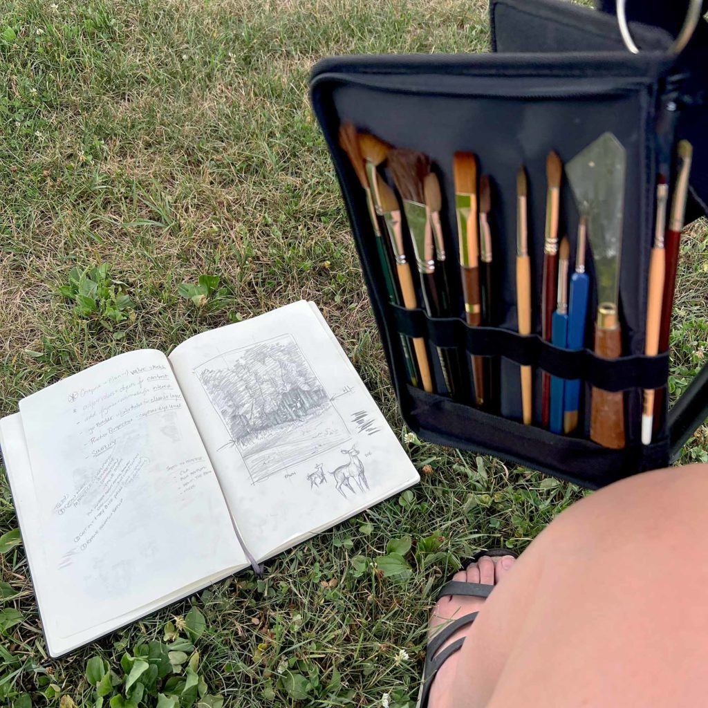 Large Watercolor Plein Air Setup Step 7: the sketchbook with a pencil sketch is setup on the ground.