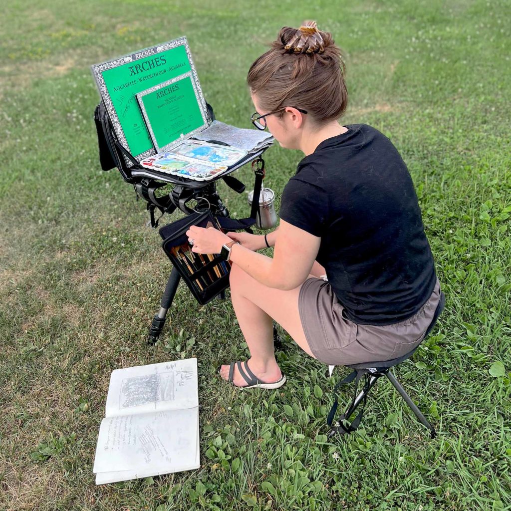 Large Watercolor Plein Air Setup Step  8: Jill is seated in front of the setup and is ready to paint.